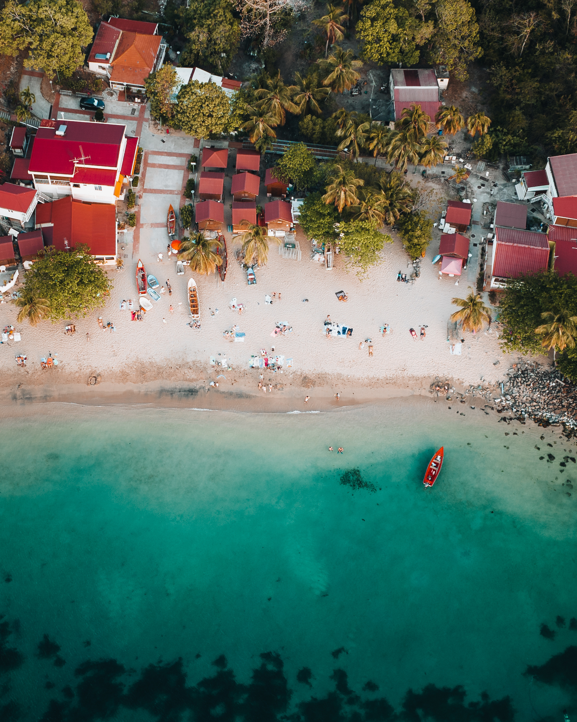 Aerial Drone view of Anse Doufur caribbean island of Martiniqze. Turquoise blue water with boats and palms. Photo taken in Martinique.